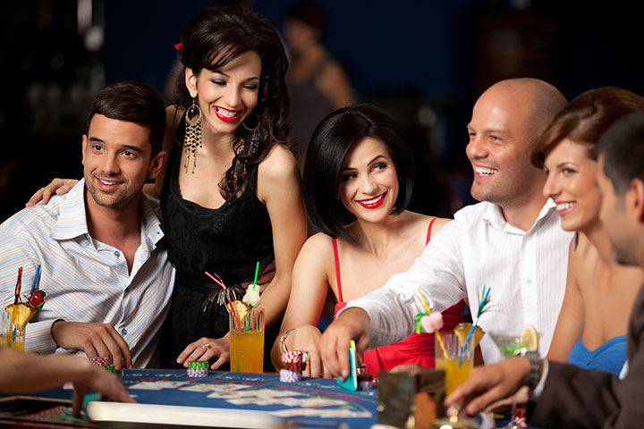 photo on group having fun on casino tables